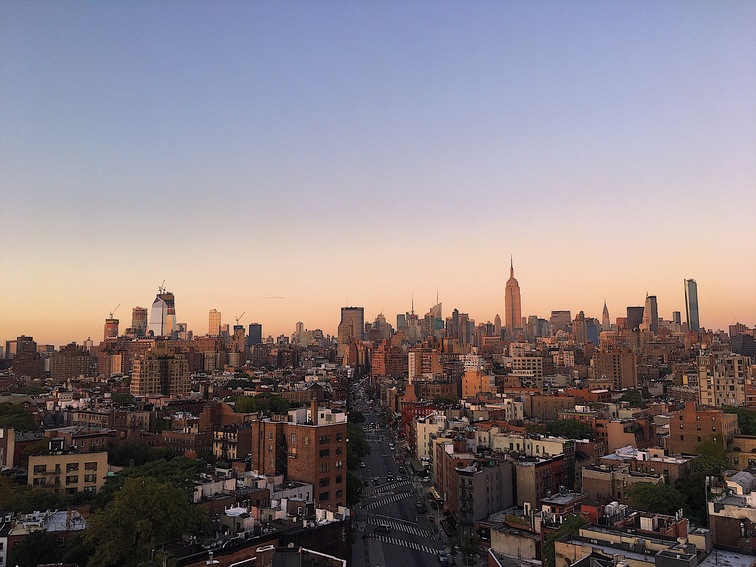 New York City skyline at sunset with the Empire State Building, representing New York vehicle registration renewal